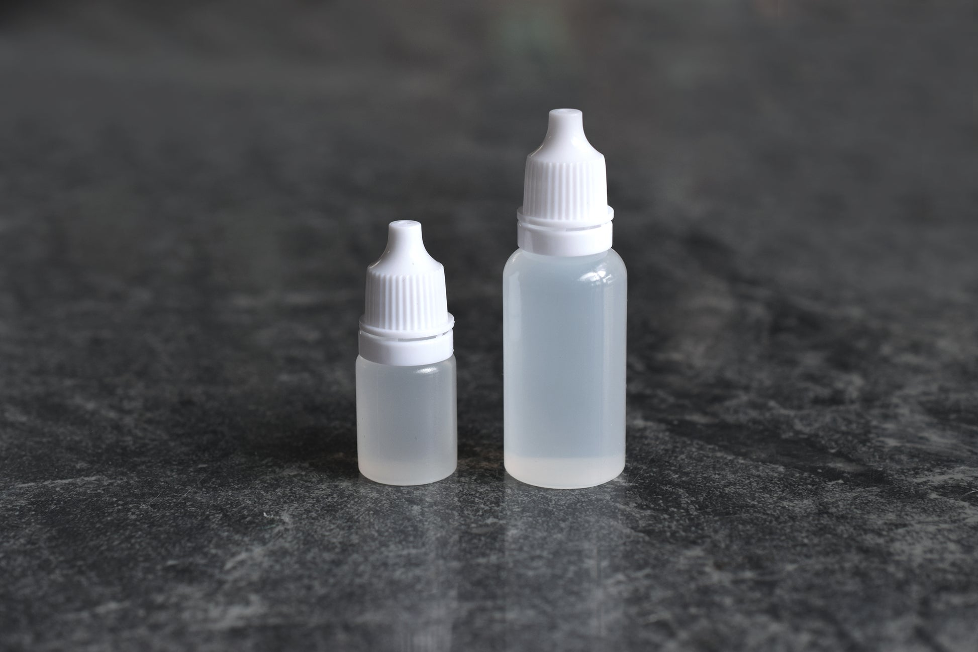 Two dropper bottles of Krytox GPL 105 silicone oil